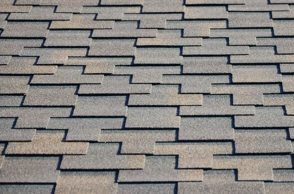 Modern roofing and decoration of chimneys. Flexible bitumen or slate shingles