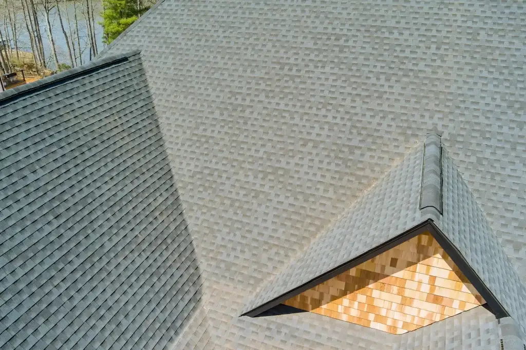 Quality of the roof work performed after installation of asphalt shingles new house is inspected on